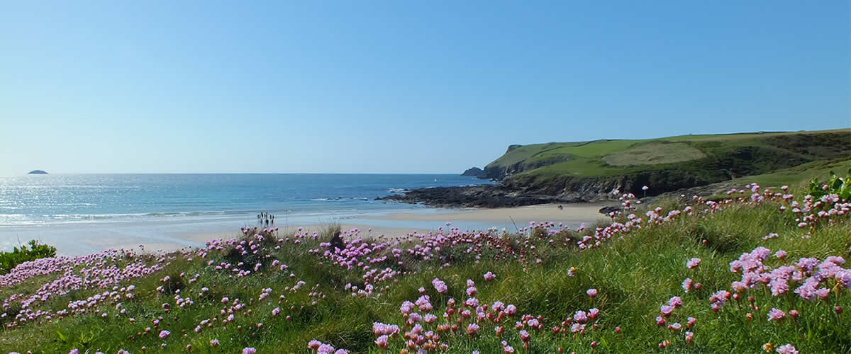 Holiday makers at Polzeath Beach